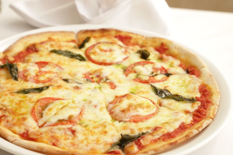 Margherita Suprema pizza with fresh basil and buffalo mozzarella