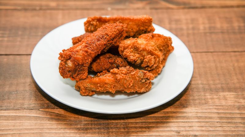 Crispy buffalo wings tossed in tangy hot sauce