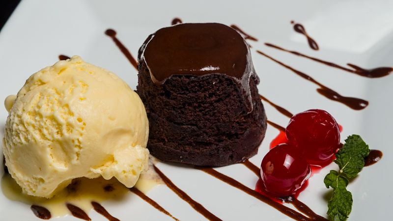 Warm chocolate lava cookie with gooey center and ice cream