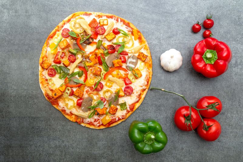 Garden Harvest vegetarian pizza with colorful fresh vegetables